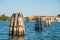 Venice seascape with wood posts, travel in Italy