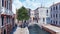 Venice street with stone bridge over narrow canal