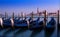 Venice sunset with blurred Gondolas. Amazing blue and purple sky