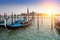 Venice. A sunset over the channel Grande and gondolas at the mooring