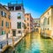 Venice sunset in Rio Greci water canal and and traditional buildings. Italy