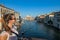 Venice - Tourist woman with panoramic view of Grand Canal in Venice, Veneto