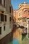 VENICE, VENETO, ITALY - Tourists, gondola riding, typical canal in Venice, September 21, 2017