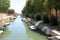 Venice waterway with many boats in the island of Sant Elena near