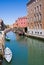 Venician cityscape with canal, bridge and houses, Italy