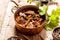 Venison Goulash in Copper Pot on Wooden Surface