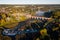 Venta Rapid waterfall, the widest waterfall in Europe and long red brick bridge in sunny, foggy autumn morning, Kuldiga, Latvia.