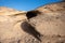 Ventifact rock formations caused by wind at La Pared Beach, Fuerteventura