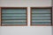 Ventilated louvered windows with wooden frames and opaque glass shutters