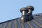 Ventilation chimneys on roof of a house.