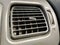 Ventilation grill in the passenger compartment. Gray car interior. Car engine grill with rust