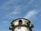 Ventilation tube of a bomb shelter against blue sky