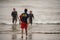 Ventura, California, USA -  September 12, 2020: A lifeguard at Ventura Harbor makes contact with swimmers to advise them of