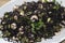 Venus black rice with prawns and courgettes