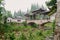 Veranda bridge over brook in raining summer morning in aged town