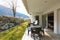 Veranda with garden and outdoor furniture.