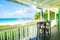 Veranda seats overlooking Caribbean beach and ocean