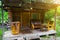 The veranda of a small wooden bathhouse on the porch of which there are benches and a large old bath. Rest and health in nature