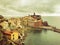 Vernazza Italy with cloudy sky background. Aerial view of Vernazza fishing village , seascape in Five lands, Cinque Terre National