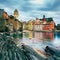 Vernazza village, church, rocks and sea harbor on sunset. Cinque