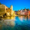 Vernazza village, church, rocks and sea harbor on sunset. Cinque Terre, Ligury, Italy