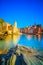 Vernazza village, church, rocks and sea harbor on sunset. Cinque Terre, Ligury, Italy