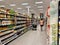 Vero Beach,FL/USA-10/28/19: A disabled senior citizen shopping in the beverage aisle of grocery store with cans and bottles of