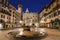 Verona - Fountain on Piazza Erbe in dusk and Porta Leona and Palazzo Maffe