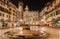 Verona - Fountain on Piazza Erbe in at night and Porta Leona and Palazzo Maffei