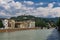 Verona, Italy Adige river view with banks buildings. Day view of hilltop church and sanctuary Madonna di Lourdes