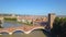Verona, Italy: Aerial view of Castelvecchio Bridge Ponte di Castelvecchio and Castelvecchio Castle. Flying over historic city