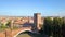Verona, Italy: Aerial view of Castelvecchio Bridge Ponte di Castelvecchio and Castelvecchio Castle. Flying over historic city