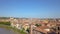 Verona, Italy: Aerial view of Castelvecchio Castle. Flying over the historic city center  with typical Italian apartment rooftops.