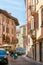VERONA, ITALY - AUGUST 17, 2017: Narrow street of Verona high vibrant building facades.