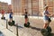 VERONA, ITALY - AUGUST 17, 2017: Tourists ride the segways on the street in Verona.