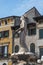 Verona, Italy - August 6, 2019: People walk by an old medieval Fontana Madonna Verona on the street