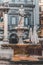 Verona, Italy - August 6, 2019: People walk by an old medieval Fontana Madonna Verona on the street