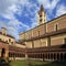 Verona, Italy - historic city center - external view of Basilica of Saint Zeno Maggiore with church tower, inner churchyard and