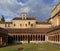 Verona, Italy - historic city center - external view of Basilica of Saint Zeno Maggiore with church tower, inner churchyard and