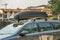 Verona, Italy - October 21, 2019: A car with roof baggage trunk parked on the side of the street on a parking lot