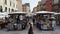 Verona, Italy. Views of the famous Market square Piazza delle Erbe. People and tourists are walking along the square