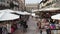 Verona, Italy. Views of the famous Market square Piazza delle Erbe. People and tourists are walking along the square