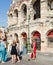Verona, Italy â€“ 19 July 2014 : Tourists admiring a Roman centurion in Verona in front of the famous amphitheater