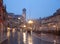 Verona - Piazza Erbe in rainly dusk and Porta Leona and Palazzo Maffei