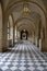 VERSAILLE FRANCE: Interior Walkway into Courtyard of Chateau de Versailles, the estate of Versaille home of Louis XIV, France -AU