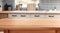 Versatile Display: Empty Wooden Table on Blurred Kitchen Bench Background.