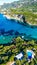 Vertical aerial of Corfu island surrounded by turquoise waters of Ionian sea, Cape Drastis in Greece