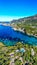 Vertical aerial of Corfu island surrounded by turquoise waters of Ionian sea, Cape Drastis in Greece
