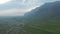 Vertical aerial drone view of haze panorama of Iceland green countryside. Amazing in nature. Birds eye stunning view of