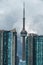 Vertical aerial shot of CN Tower in Toronto under cloudy sky